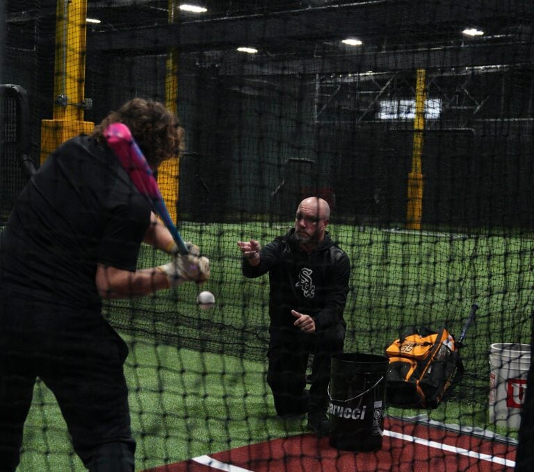 Elite Baseball Training coach working with a hitter during a private lesson at the Mundelein facility